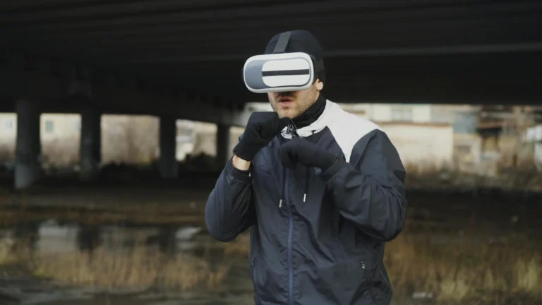 Person playing VR sports game with virtual reality headset